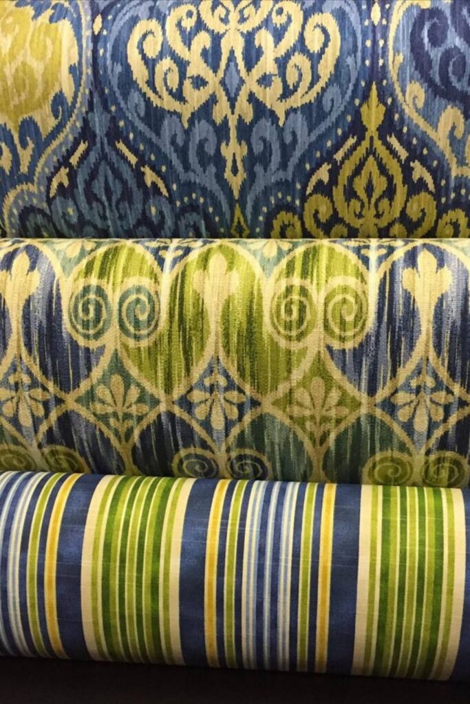 Blue and green decorative fabric rools.